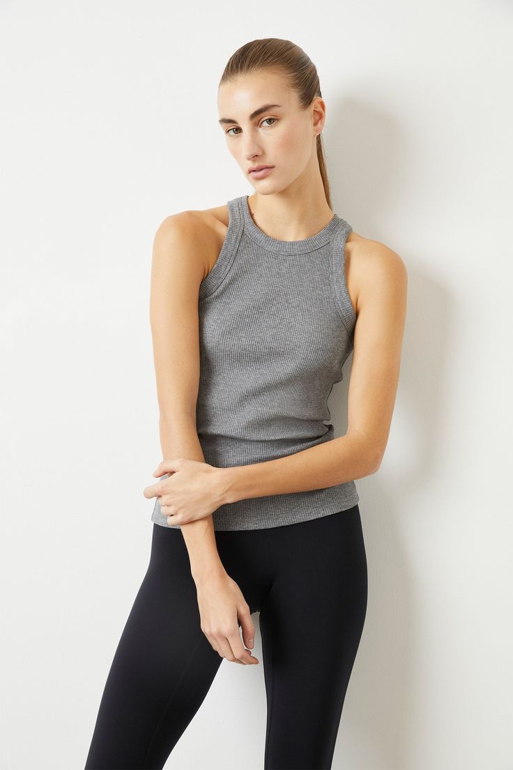 WSLY The Rivington Ribbed Tank – BANDIER Ribbed Stretch Tank Top, High Stretch Ribbed Tank Top, Ribbed Sleeveless Top With Medium Support, Ribbed Elastane Tank Top, Versatile Fitted Tank Top For Workout, Ribbed Stretch Tops For Yoga, Fitted Ribbed Elastane Tank Top, High Stretch Seamless Tank Top For Layering, Everyday Fitted Ribbed Activewear