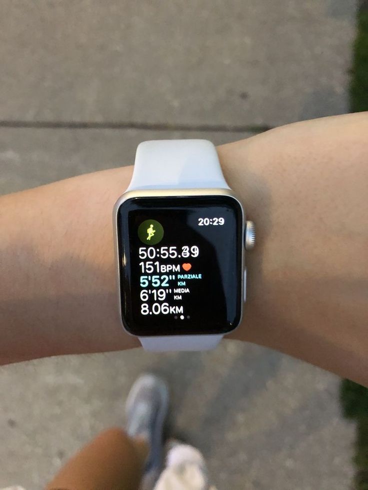 a person is showing off their apple watch on their arm, with the time displayed