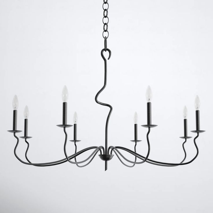 a black chandelier with eight lights hanging from it's center and two rows of candles in the middle