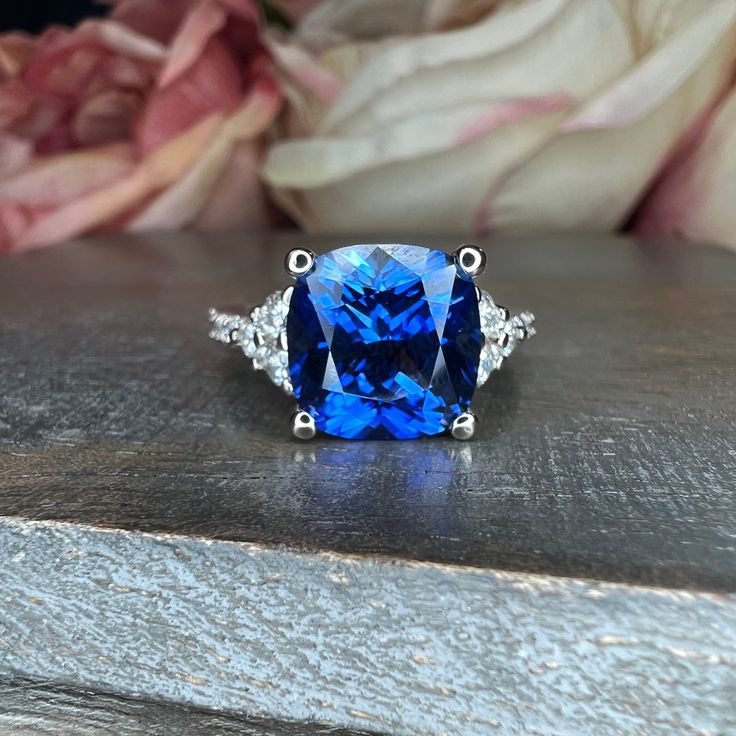 a blue ring sitting on top of a wooden table