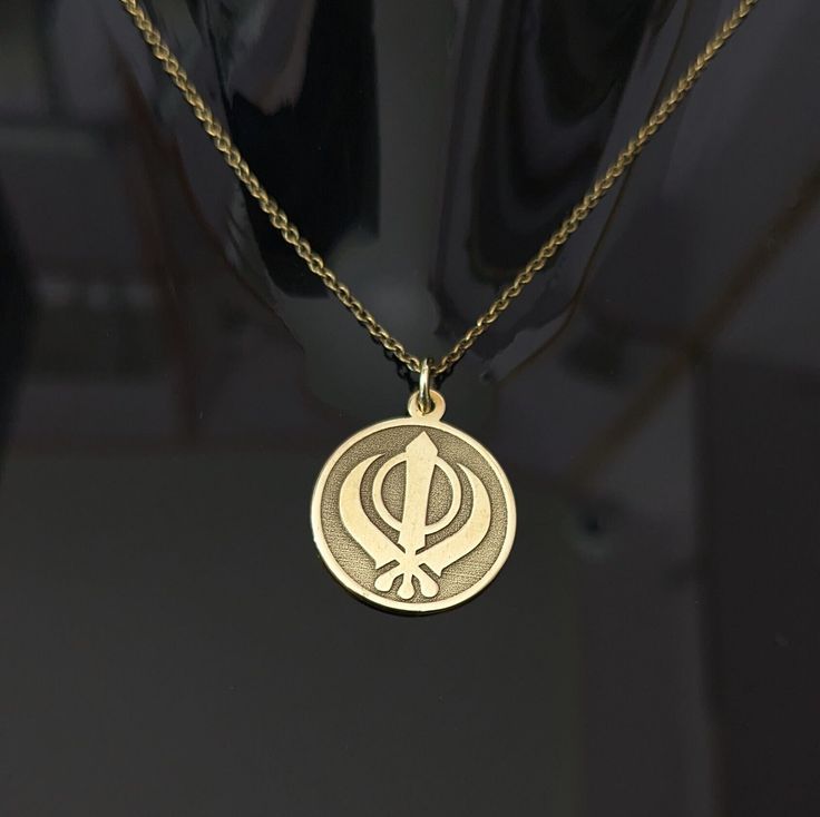 About Item  Item           :- Khanda Pendant Material   :- Sterling silver & Brass Item Title :- Sterling Silver KHANDA Pendant, Handmade Sikh Khalsa Necklace, Religious Charm Necklace, Sikh Jewelry, Handmade Gift For Him NOTE Q1. Does Brass Jewelry Turn Your Skin Green? The Science Behind Brass Turning Skin Green Brass jewelry can turn skin green due to a chemical reaction between the metal and your sweat. This reaction is caused by the copper in the brass oxidizing when it comes into contact w Guru Govind, Handmade Gift For Him, Handmade Gifts For Him, Unique Pendant Necklace, Waheguru Ji, Black Beaded Jewelry, Frame Gallery, Necklace Online, Unique Pendant