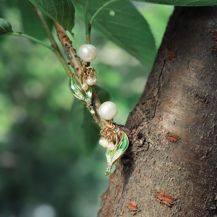 Selenichast Lily of The Valley Stud Enamel Pearl Dangle Earrings Jewelry can be as a wedding or birthday gift for your friends or famlies. Or you can wear it to attend a party or go on vacation. Elevate your style with these exquisite Lily of The Valley Enamel Earrings. Perfectly crafted to showcase delicate tones of green and white, this elegant design will add a chic, floral touch to any outfit. Bring a touch of sophistication and luxury to your jewellery collection with this timeless piece.>> Gold Plated Flower Charm Earrings For Wedding, White Gold Plated Flower Earrings For Wedding, Gold Plated Dangle Flower Earrings For Wedding, Wedding Flower Dangle Earrings In Gold Plated, Leaf-shaped Yellow Gold Jewelry For Weddings, Leaf-shaped Gold Jewelry For Wedding, Leaf-shaped Yellow Gold Wedding Jewelry, Gold Leaf-shaped Jewelry For Wedding, Leaf-shaped Wedding Jewelry For Pierced Ears