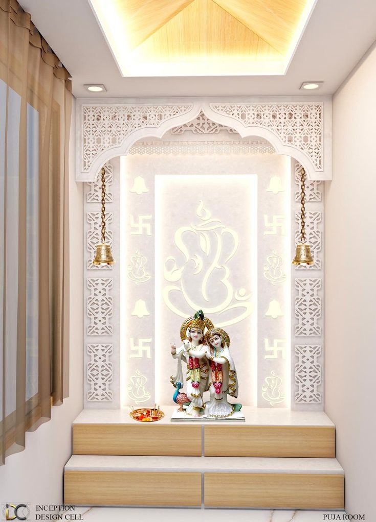 a white and gold decorated room with two statues on the bench, lights hanging from the ceiling