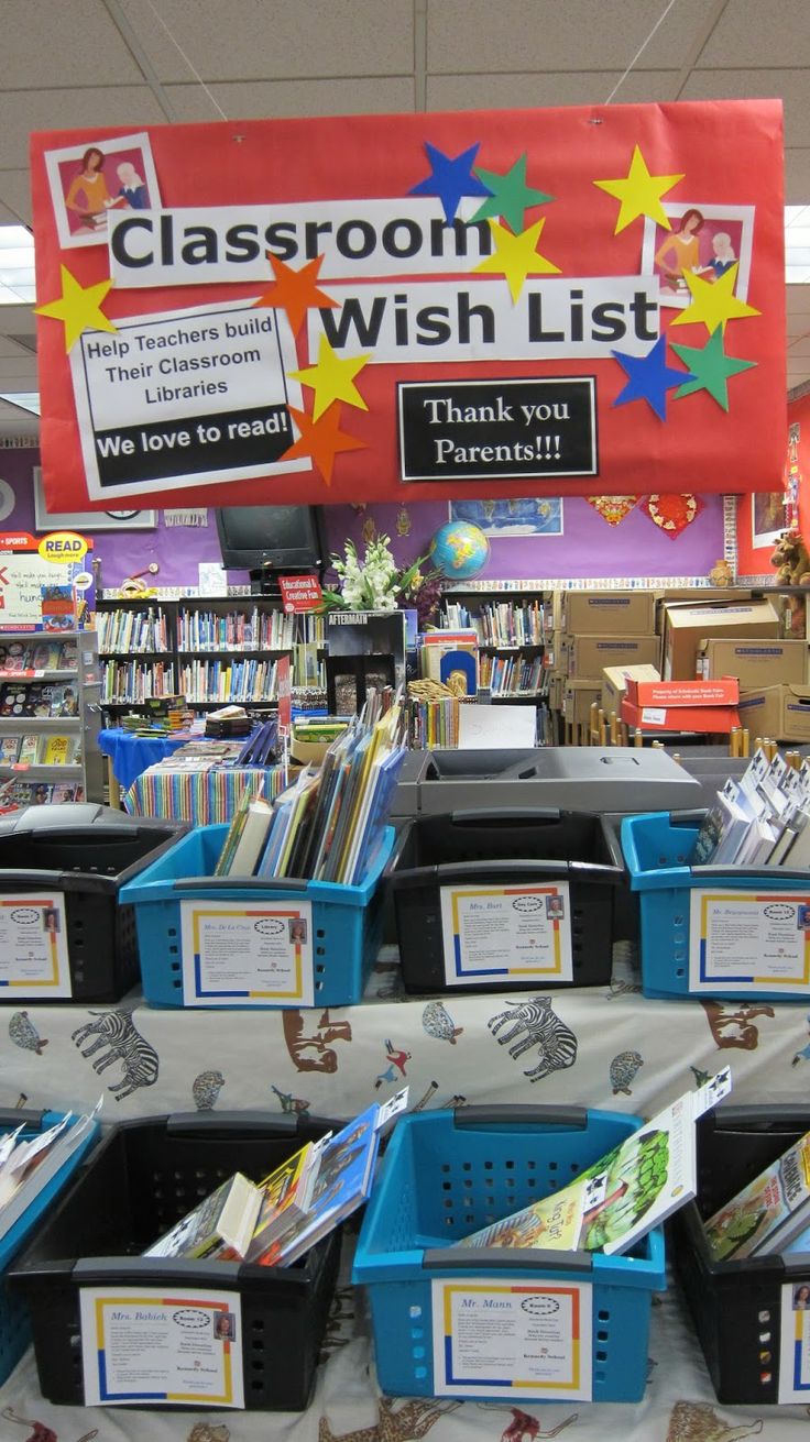 the classroom wish list is on display at the library's book sale, with many books in bins