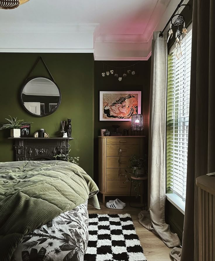 a bedroom decorated in green and black with a checkered area rug on the floor