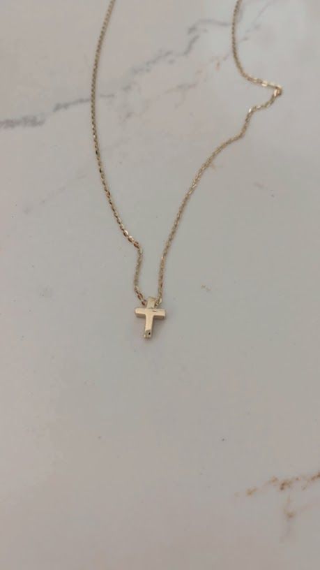 Ensure lasting memories for the special moments in your life with this 14K gold tiny cross necklace, a religious jewelry gift. Crafted for women of Christian faith, this small cross pendant is bold and designed in a 3D mini cross configuration. Free shipping offered. This piece is beautiful, elegant, shiny, and suitably sturdy for a baptismal gift. ⁙ Materials: 14K Yellow Gold⁙ Dimensions: 8MM Height by 6MM Width in diameter, the chain is very sturdy and 1MM wide, it is 16"-18" it can be hooked Everyday Cross Pendant Charm Necklace, Dainty 14k Gold Cross Pendant Charm Necklace, Everyday Yellow Gold Cross Charm Necklace, Everyday 14k Yellow Gold Cross Necklace, Dainty 14k Gold Cross Necklace For Everyday, Dainty Everyday 14k Gold Cross Necklace, Dainty Yellow Gold Crucifix Cross Necklace, Dainty Yellow Gold Crucifix Necklace, Dainty 14k Gold Cross Charm Necklace