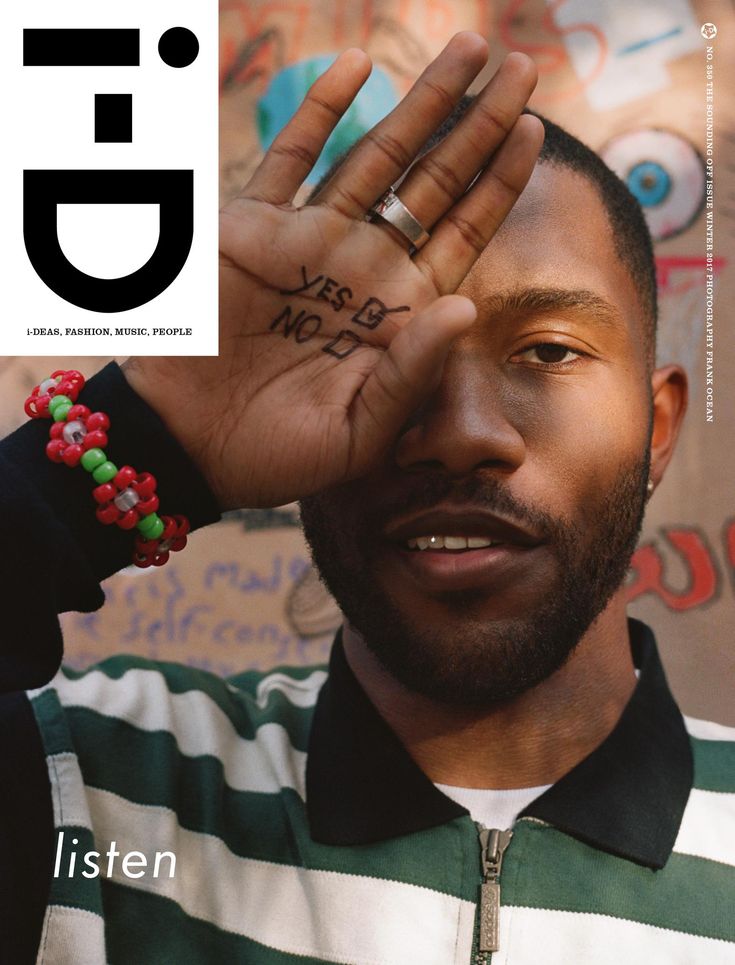 a man is holding his hand up with the word love written on it in front of his face