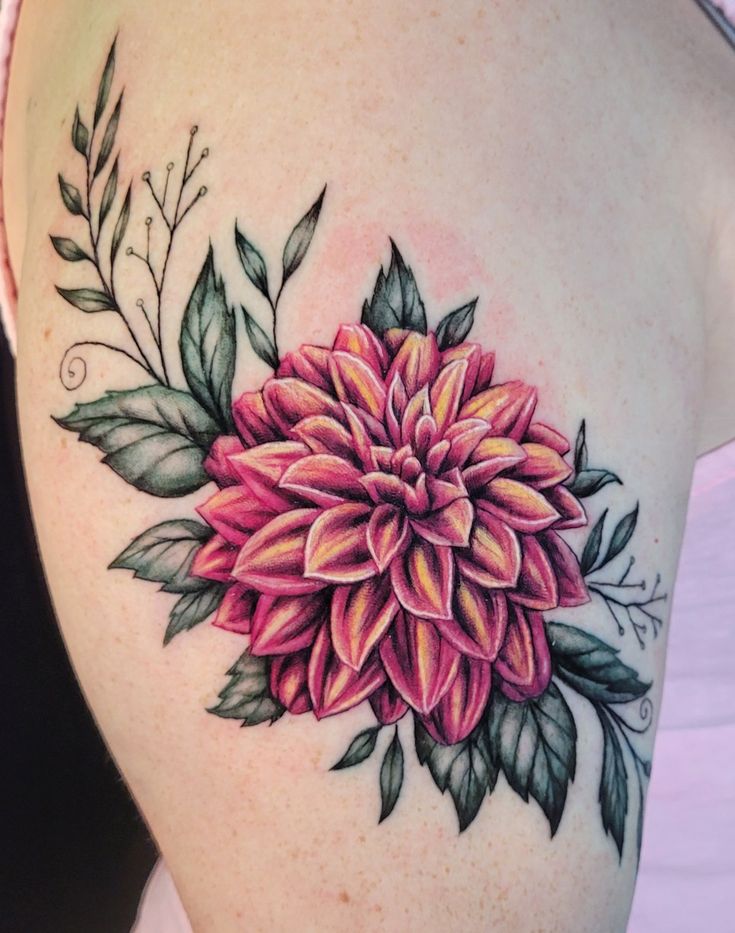 a woman's thigh with a flower tattoo on it