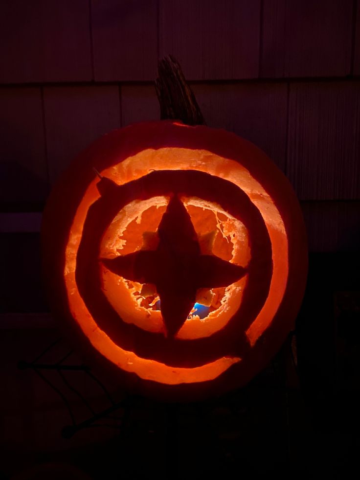 a carved pumpkin with a star in the center