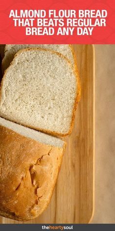 a loaf of bread sitting on top of a wooden cutting board