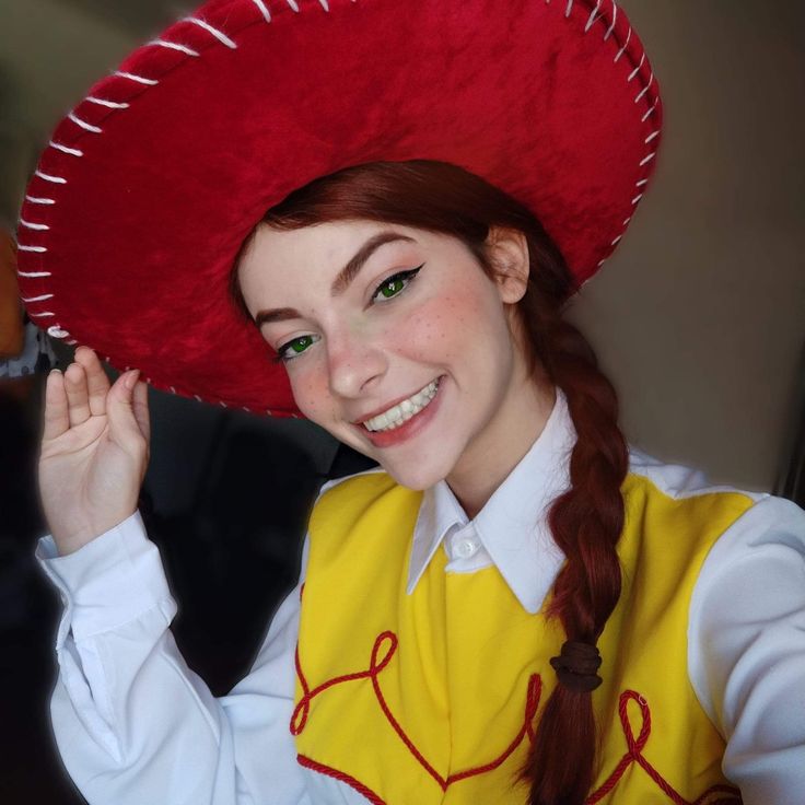 a woman wearing a red hat and yellow vest