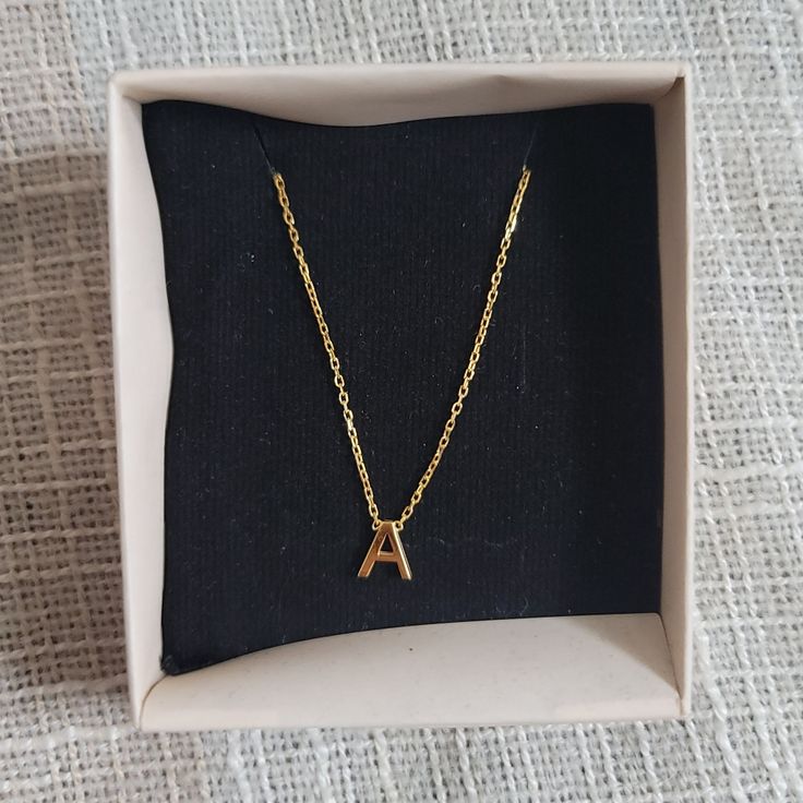 Nib "A" Gold Necklace Contemporary Gold Plated Chain Necklace With "A" Pendant. I Actually Got This On Etsy As A Gift For One Of My Bridesmaids, But Decided To Go A Different Way. (With The Gift, Not The Bridesmaid Lol). Perfect For Gifting! Comes In The Cute Little Pine Box. Brand New; Never Worn Or Even Taken Out Of The Box. All Reasonable Offers Accepted! Message Me For Free Shipping On Orders Over $50! Create A Bundle To Get The Best Price. Message Me With Any Questions! Yellow Charm Necklace With Adjustable Chain As Gift, Elegant Yellow Charm Necklaces For Gifts, Elegant Yellow Charm Necklace For Gift, Dainty Yellow Necklace For Gift, Dainty Yellow Necklace For Gifts, Yellow Clavicle Chain Necklace For Gift, Yellow Clavicle Chain Necklace As Gift, Elegant Personalized Yellow Necklace, Yellow Initial Pendant Necklace For Gifts