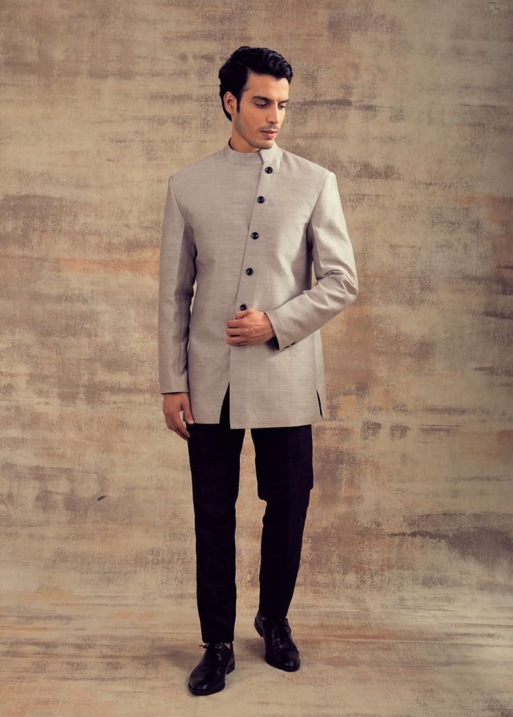 This Blue Color Indo Western Jacket is in Raw Silk with an asymmetrical button line. Linin of the jacket kept in black contrast with trousers. This Indo Western Jacket can also be paired with any black colour Kurta Sets. Perfect fit for any wedding function. Brand: Panache Haute Couture Availability: Online and In-store Delivery Time: 4-6 Weeks Fabric: Jacket - Dupion, Trousers: Raw Silk Customisation: Colour Options Available. For more colour options please contact our team through WhatsApp+614 Western Jacket, Wedding Function, Indo Western, Black Colour, Raw Silk, Grey Color, Black Color, Gray Color, Perfect Fit