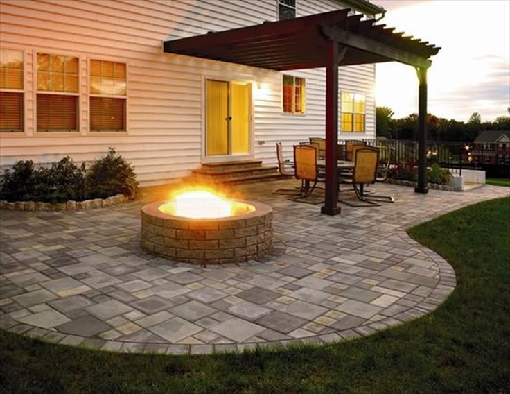 a fire pit sitting on top of a stone patio