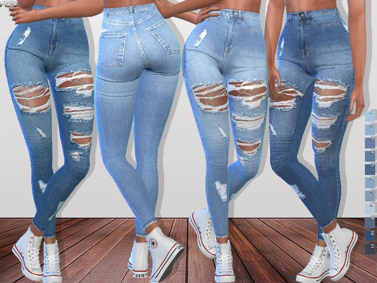 three women in ripped jeans standing next to each other