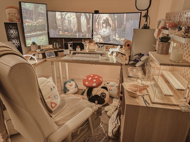 a computer desk with two monitors and stuffed animals