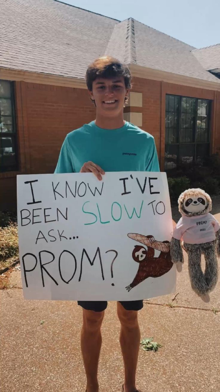 a person holding a sign that says i know i've been slow to ask prom