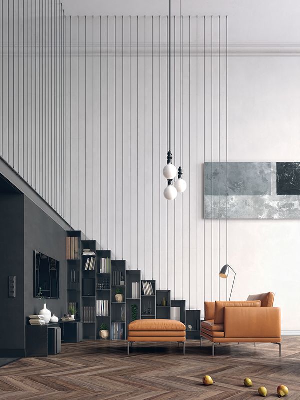 an image of a living room with stairs in the center and bookshelves on the other side