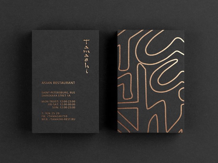 two business cards on top of each other with an abstract design in gold and black