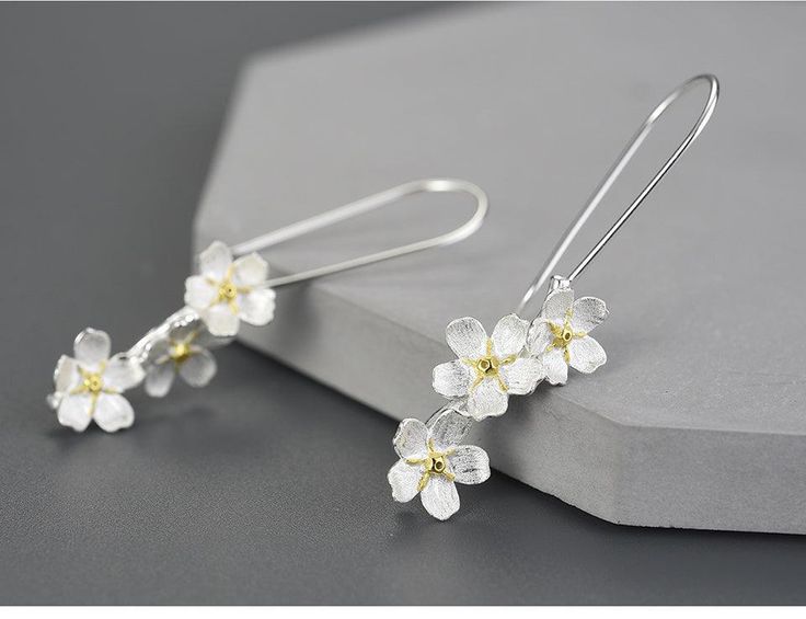 Flower Dangle Earring White Sterling Silver Earrings For Mother's Day, Silver Drop Earrings For Mother's Day, Elegant Spring Earrings For Anniversary, Spring Teardrop Jewelry, Spring Jewelry For Anniversary, Elegant Spring Anniversary Jewelry, Handmade Flower Earrings For Formal Occasions, Elegant Silver Flower Earrings For Mother's Day, Spring Sterling Silver White Jewelry