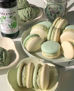 there are many different types of macaroons on the plates