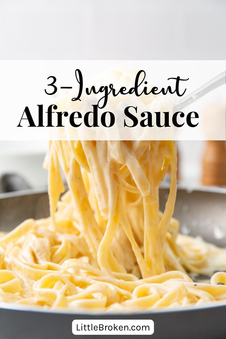 a pan filled with alfredo sauce being stirred by a ladle over the top of it