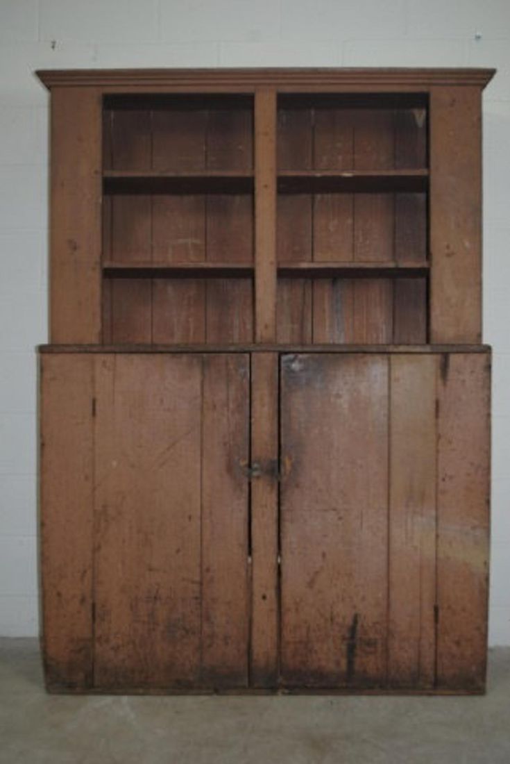 an old wooden cabinet with two doors