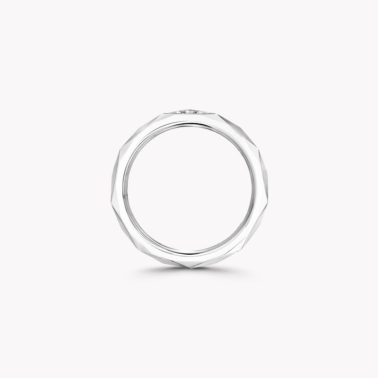 A striking interpretation of the architectural silhouette of a round diamond, the 2.3mm Laurence Graff Signature pavé diamond band is handcrafted in 18 carat white gold to display angular facets. Pavé diamonds are set to shine upon a single facet, bringing a touch of brilliance to the graphic and modern design. Inspired by Laurence Graff’s devotion to the world’s finest diamonds, the Laurence Graff Signature collection translates the hypnotic beauty of a diamond in angular, multifaceted jewels. Graff Engagement Ring, Hypnotic Beauty, Graff Diamonds, Signature Rings, Pave Diamond Band, Bridal Bands, White Gold Band, Fancy Color Diamonds, Diamond Band