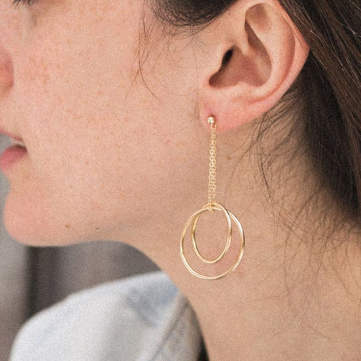 DOUBLE CIRCLE EARRINGS These Double Circle Earrings are handcrafted for you with the utmost care. They are super easy to put on and light- the ultimate desk to dinner must-have. Sleek, playful and eye-catching. ITEM SPECIFICATIONS • Material: High Quality Solid 925 Sterling Silver• Finish: Gold• Dimensions: 2.55 x 1 INCHES Modern Round Earrings For Gifts, Modern Round Linear Earrings For Everyday, Modern Round Linear Earrings For Everyday Wear, Modern Dangle Jewelry For Gifts, Modern Drop Earrings As A Gift, Modern Drop Earrings For Gift, Minimalist Nickel-free Linear Earrings As Gift, Minimalist Nickel-free Linear Earrings For Gift, Modern Adjustable Earrings For Gift