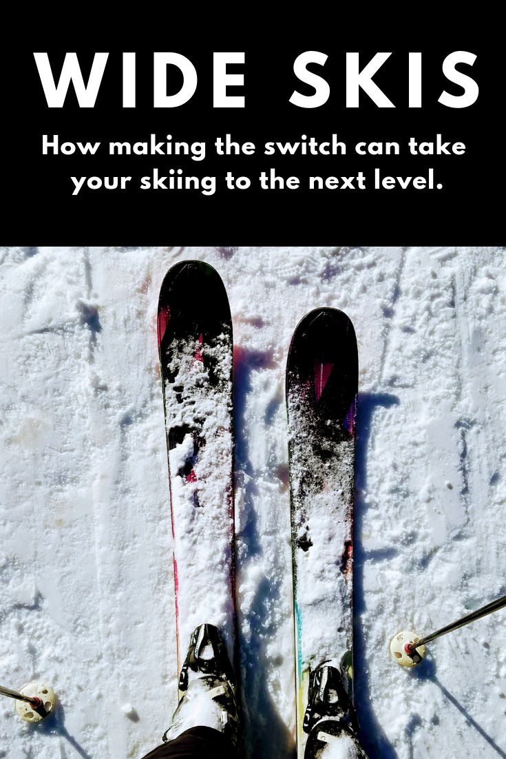 a pair of skis sitting on top of snow next to the words wide skis