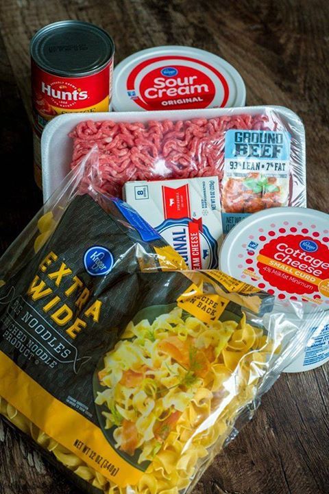 an assortment of frozen food on a wooden table