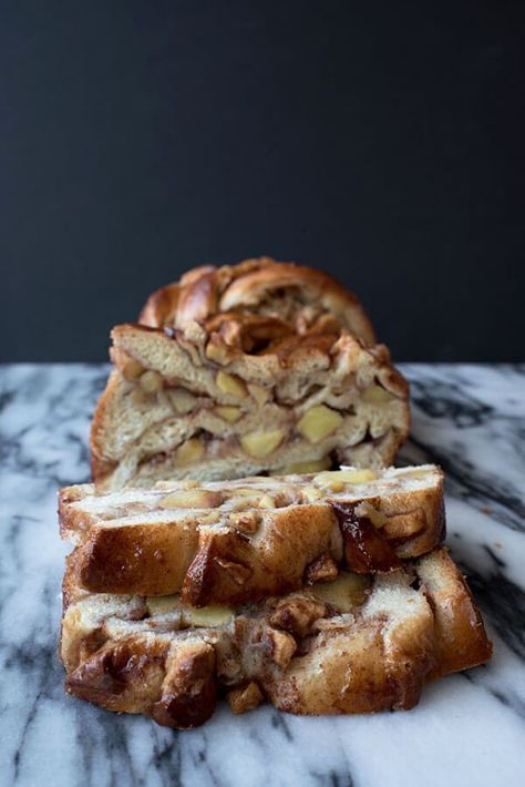 two pieces of bread sitting on top of a marble counter