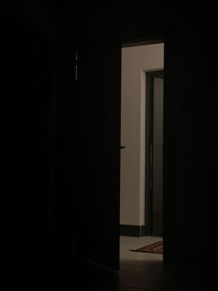 an open door leading into a dark room