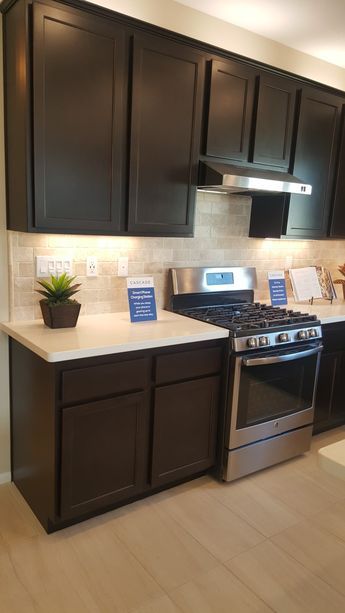 the kitchen is clean and ready for us to use it's new stove, sink, and dishwasher