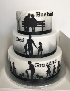 three tiered cake decorated with silhouettes of people holding hands and the words husband, dad, and grandad