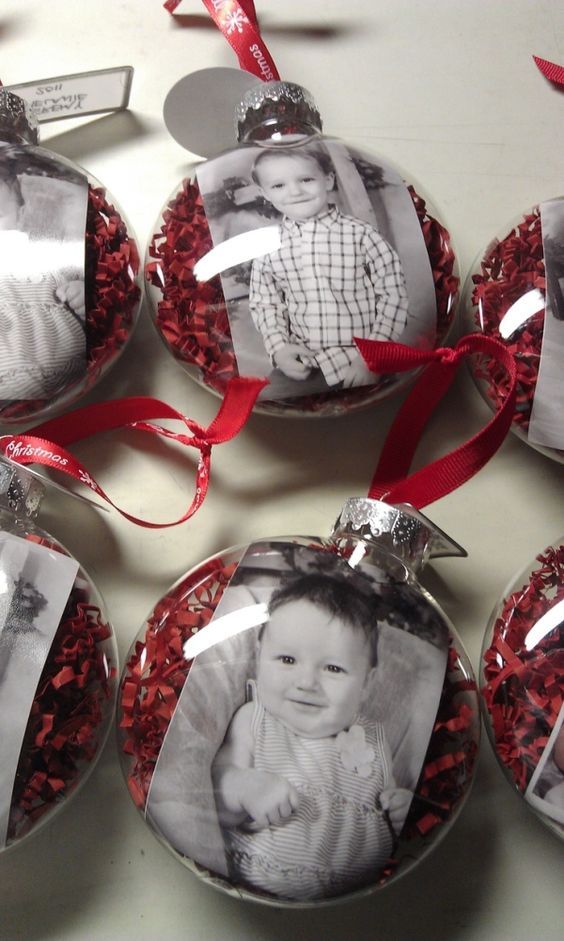 christmas ornaments with an ornament shaped like a baby's photo