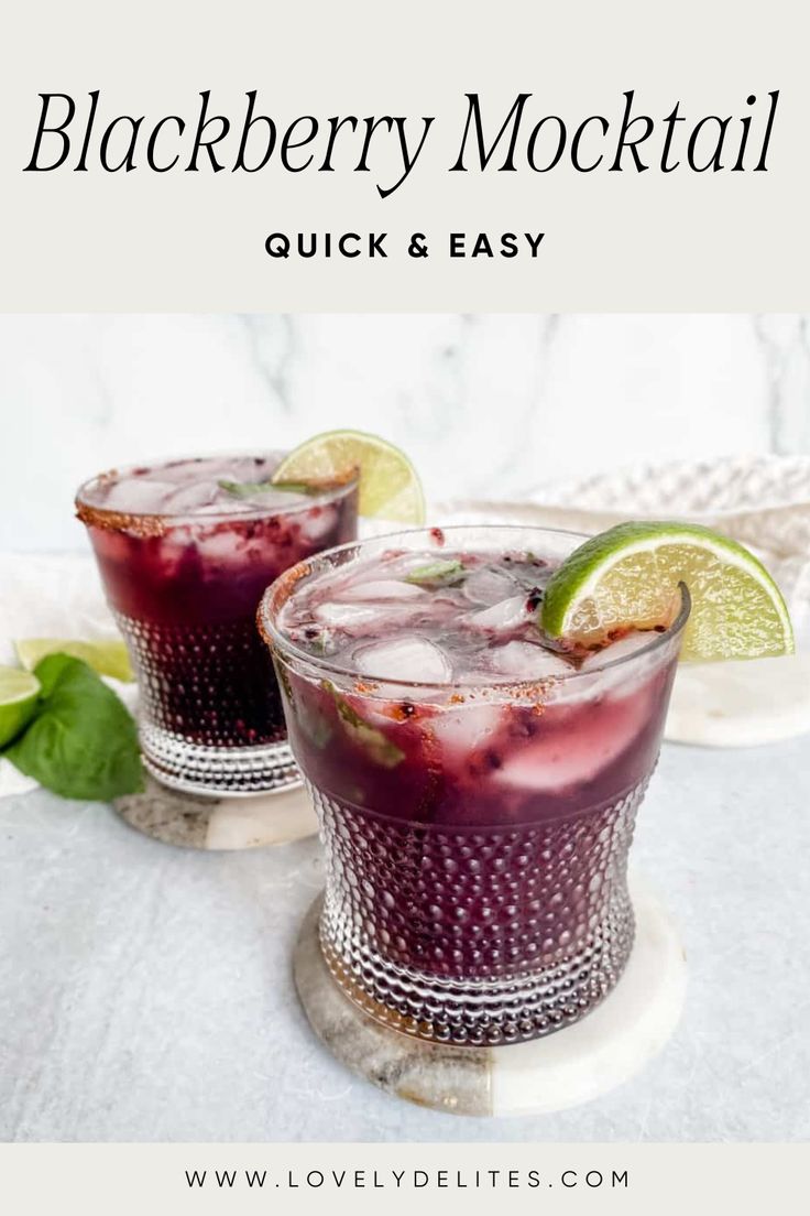 two glasses filled with blackberry mojita and garnished with limes on the side