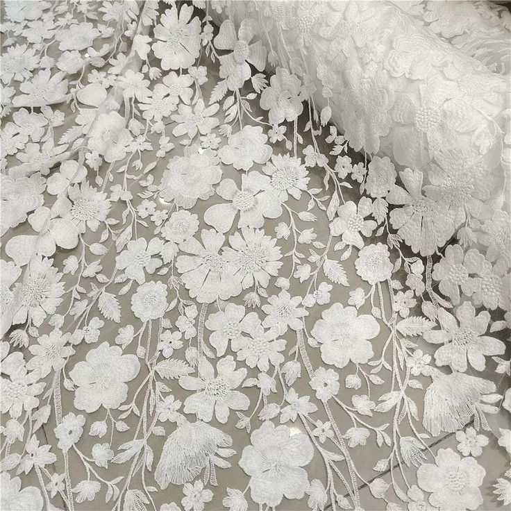 white lace with flowers and leaves on it