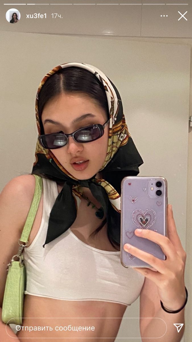 a woman taking a selfie in the mirror with her cell phone and wearing sunglasses