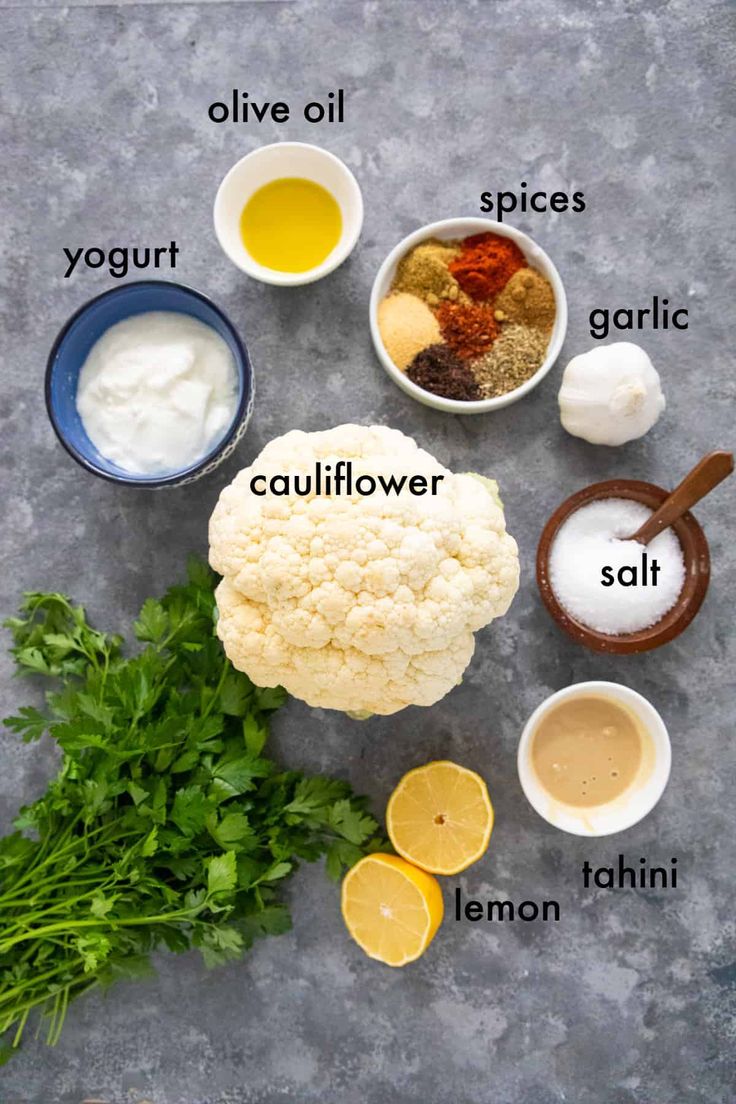 ingredients for cauliflower soup laid out on a gray surface with the words above it