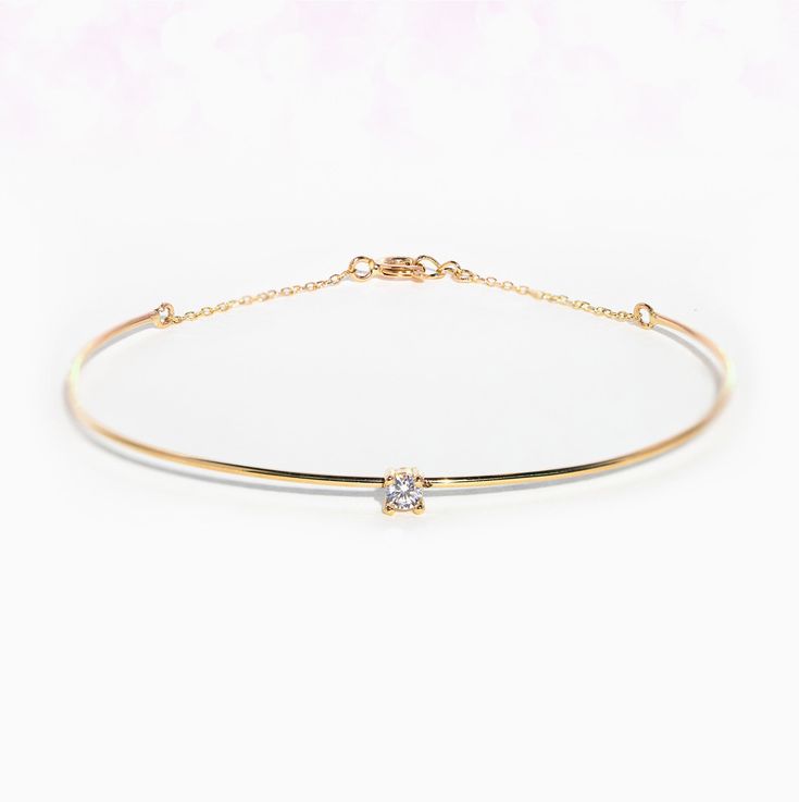 If you've been searching for the perfect Fine bracelet, look no further! Our Fine Amulet Bangle Bracelet features a classic design that is perfect for everyday wear. Not only does it look amazing when worn alone, but it looks even better with you stack it with your other GC favorite pieces! Classic Adjustable Bangle For Everyday Luxury, Elegant Everyday Cuff Bracelet, Elegant Bracelets With Smooth Bezel, Dainty Adjustable Bracelet For Everyday, Minimalist Bangle Bracelet With Single Diamond, Adjustable Diamond Bangle In Classic Style, Timeless Stackable Diamond Bracelet With Adjustable Fit, Yellow Gold Bangle Bracelet With Single Diamond, Classic Adjustable Diamond Bangle