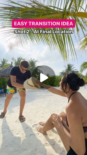 a man kneeling down next to a woman on top of a sandy beach under a palm tree