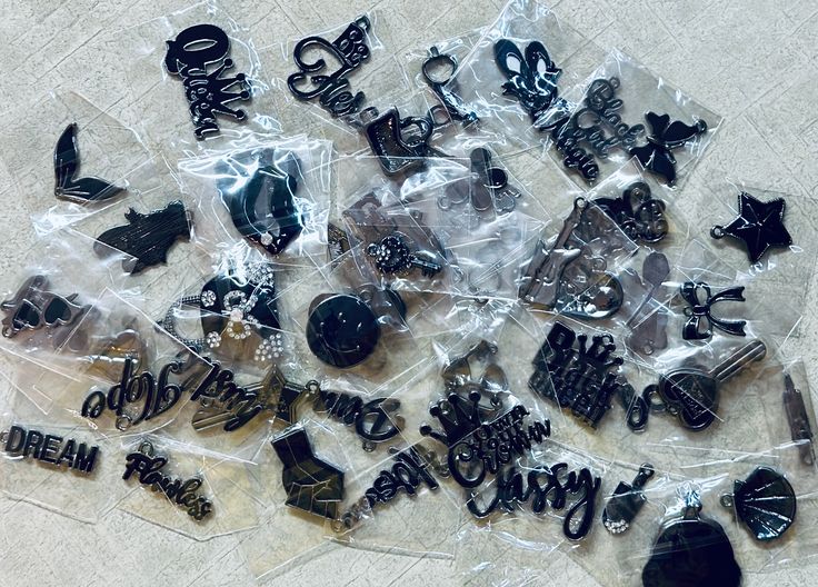 Random selected Black on Black Charms.   Charms will be selected among those pictured and others in stock.  These are Charms that can be used for bracelets, necklaces, watch bands, etc. These are a mix will be small, medium and/or large.  Please note that custom orders may have longer processing times.  Please send a message to request custom order. We ship orders within 2 business days Monday thru Friday. Please make sure we have correct address when placing order. Bracelet Charms, Black On Black, Shoe Charms, Custom Orders, Watch Bands, Charm Bracelet, Charms, Solid Color, Necklaces