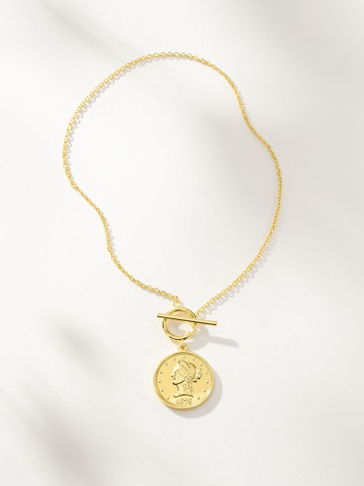 Baja Necklace | Gold | Product Image | Uncommon James Gold Chain Necklace With Coin Pendant For Layering, Everyday Gold Plated Pendant Coin Necklace, Everyday Gold Plated Coin Pendant Necklace, Gold Medallion Necklace With Delicate Chain For Everyday, Gold-tone Brass Coin Necklace, Minimalist Coin Pendant Necklace, Toggle Necklace With Coin Pendant, Chain Necklace With Coin Pendant For Layering, Gold Coin Necklace With Adjustable Chain For Everyday