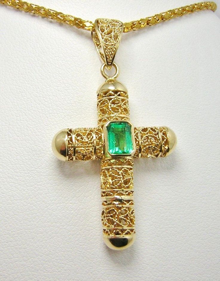 "Colombian Emerald Filigree Cross Pendant 1 Natural Emerald Square Cut Emerald / Size ~ .85 Carats Color ~ Medium-Green / Clarity ~ Type 3 Metal Purity ~ 18K Yellow Gold / Weight ~ 6.04 Grams Beautiful Holy Cross ~ Brilliant Emerald MEASUREMENTS North to South including Bail ~ 43.24 mm (1.7036 Inches) East to West at Widest Section ~ 23.75 mm (0.9357 Inches) East to West (Bail Section) ~ 5.80 mm (0.2285 Inches) Fits a Chain or Necklace 6.00 mm (0.2364 Inches Estimated Retail Replacement Value $5 Emerald Cross, Colombian Emeralds, Emerald Pendant, Cross Jewelry, Square Cut, Gold Cross, Fine Jewellery Necklace, Natural Emerald, Square Shape