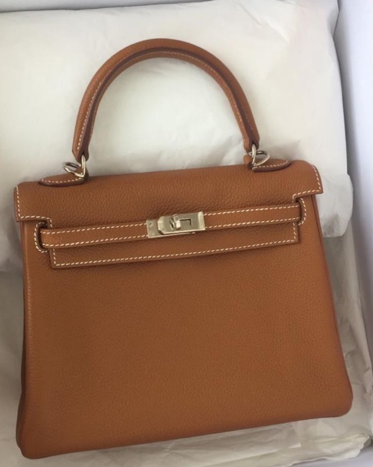 There has been increasing interest from customers for Kelly 25 in togo. So we are pleased to have this available. However the bag is currently not in the store and hence a deposit is required to secure it. We assure you the condition is beautiful and all pictures will be provided prior❤️❤️.  Model: Hermes Kelly 25 Retourne Stamp: Q stamp, 2013 Condition: Excellent  Color: Gold Hardware: Palladium  Leather: Togo Comes with: Full set, no receipt  Cash purchase: S$16,900 Hermes Kelly 25 Retourne, Kelly Hermes, Hermes Kelly 25, Kelly 25, Dream Bags, Leather Briefcase Men, Kelly Bag, Vintage Hermes, Luxury Purses