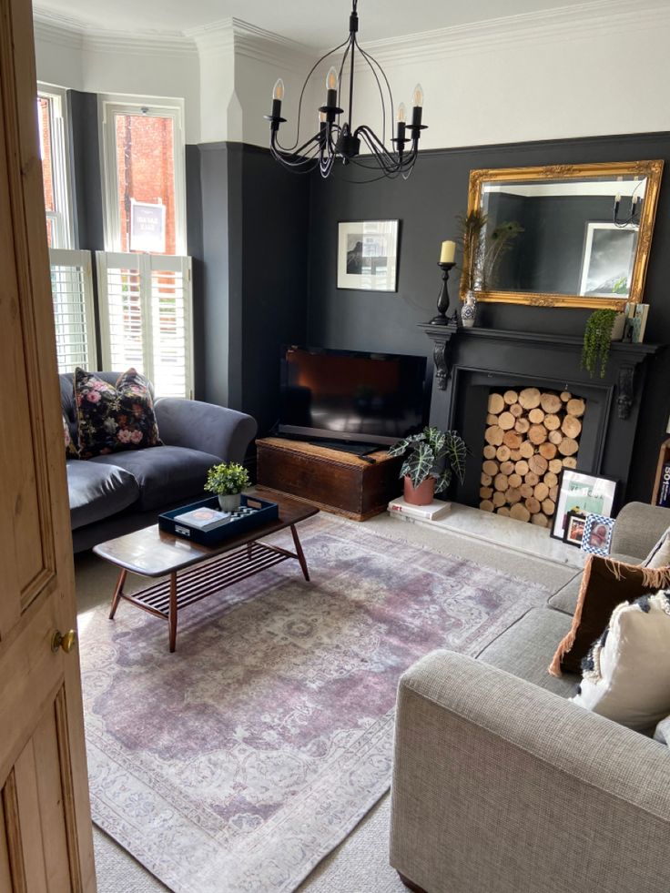 a living room filled with furniture and a fire place