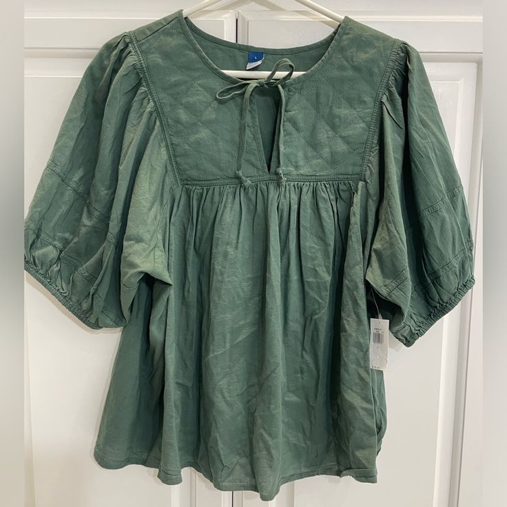 Nwt Super-Cute, Green Blouse With Quilted Neckline. Perfect Color For Fall! Casual Tops With Tie Puff Sleeves, Casual Tops With Tie And Puff Sleeves, Green Short Sleeve Blouse For Brunch, Summer Green Cotton Puff Sleeve Top, Green Cotton Puff Sleeve Top For Summer, Short Sleeve Puff Top For Daywear In Fall, Fall Puff Sleeve Top With Short Sleeves For Daywear, Fall Puff Sleeve Top For Daywear, Casual Tops With Tie Sleeves For Brunch