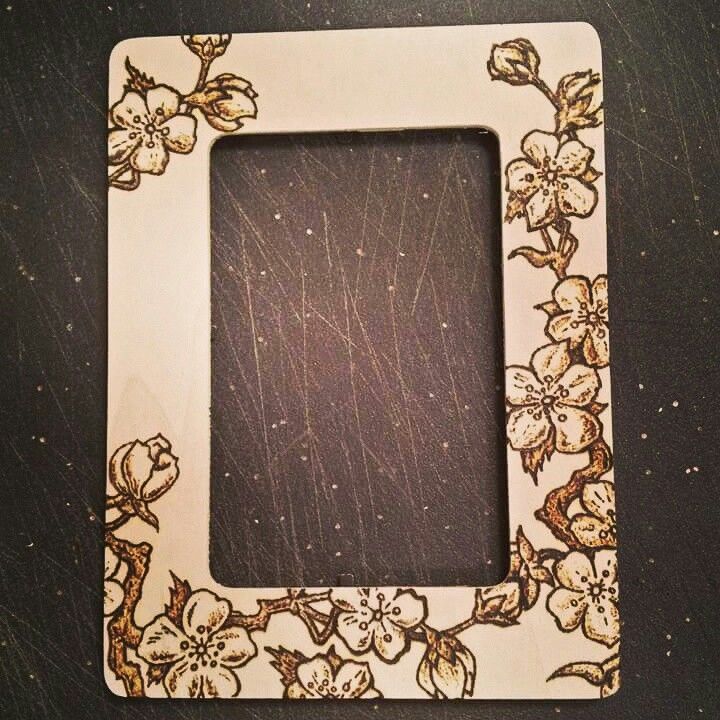 an old photo frame with flowers painted on it