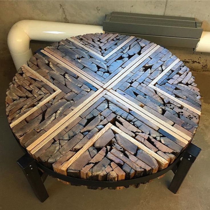 a round table made out of wooden planks